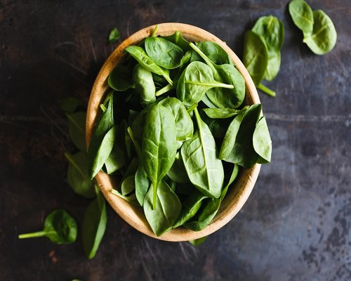 Fresh green spinach leaves close-up